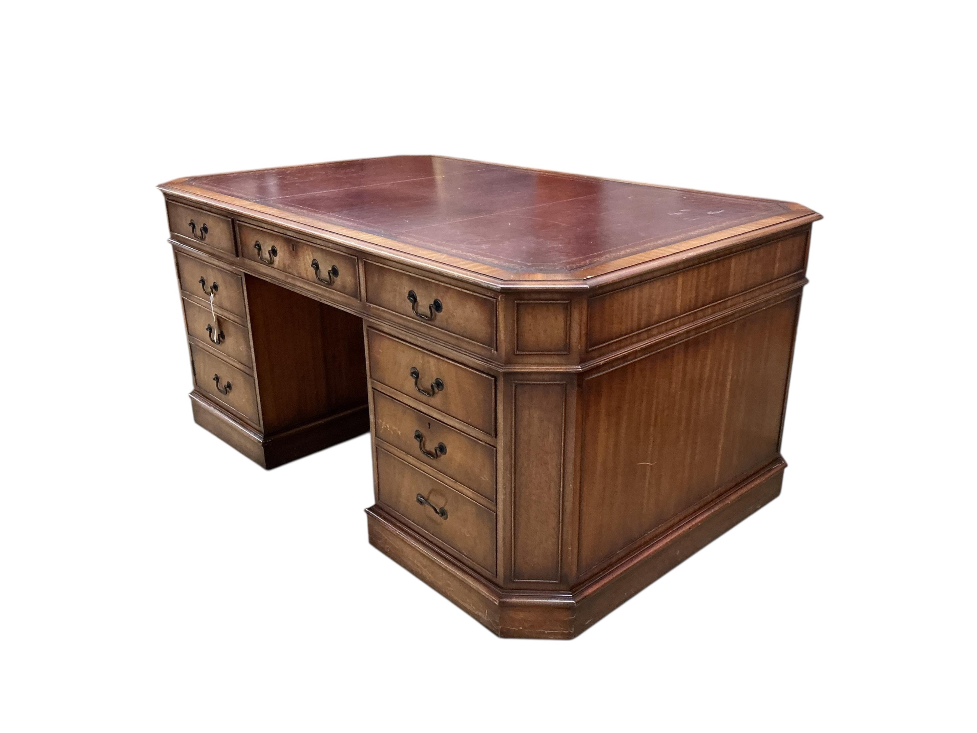 A reproduction George III style mahogany pedestal partners desk, width 166cm, depth 106cm, height 77cm